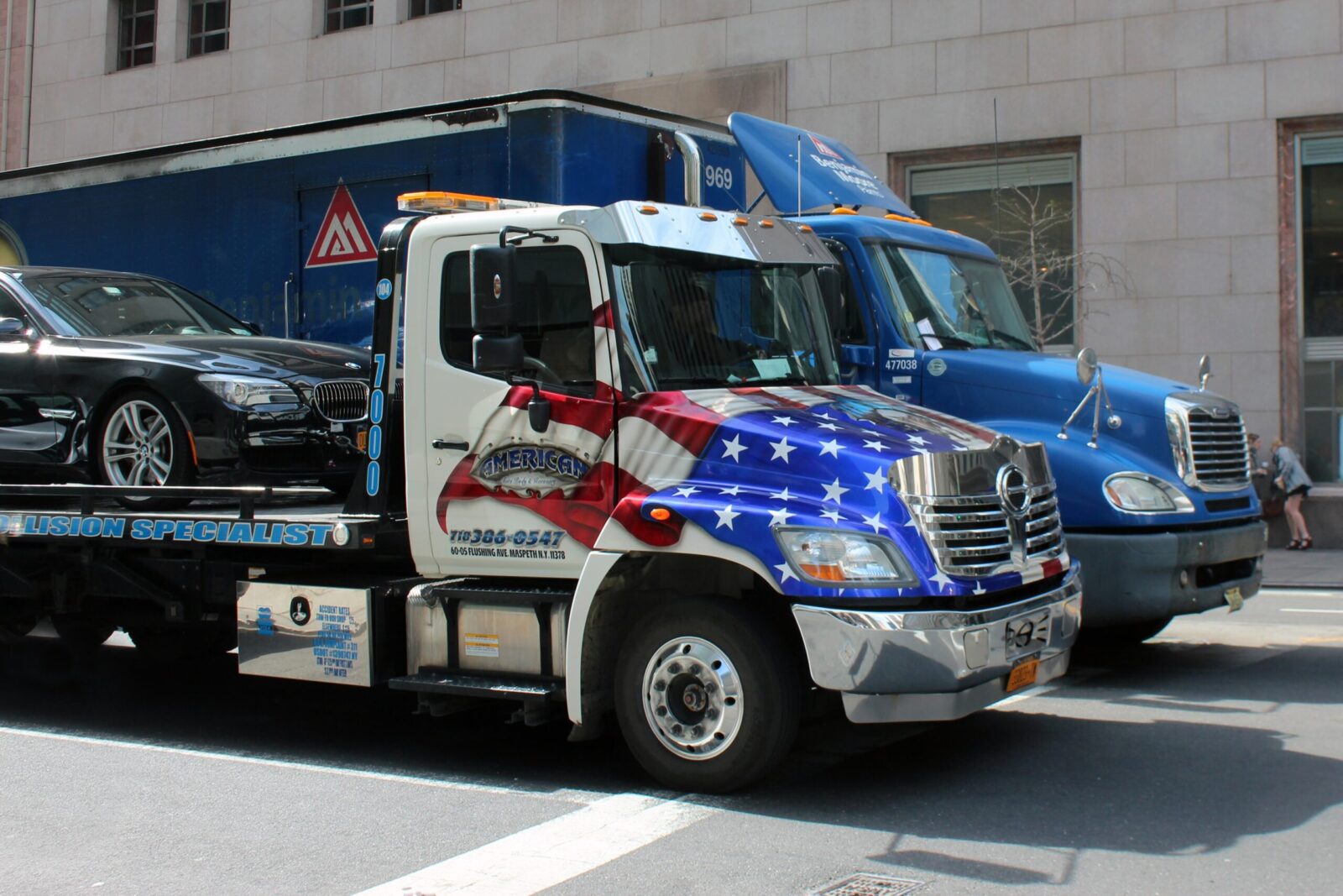 A truck with printed American flag in front