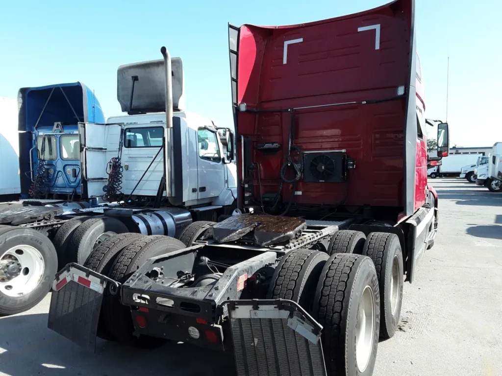 A bobtail red truck