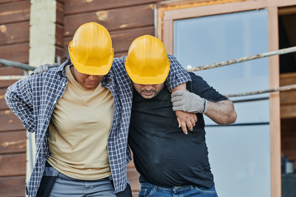 A man helping another man to walk