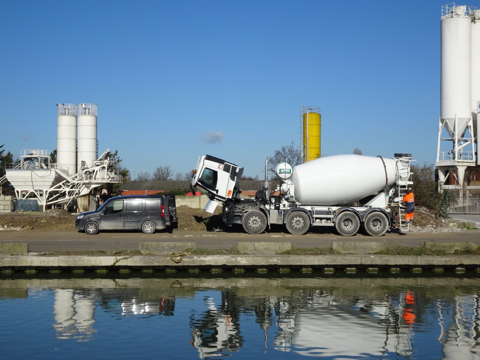 A white cement truck  